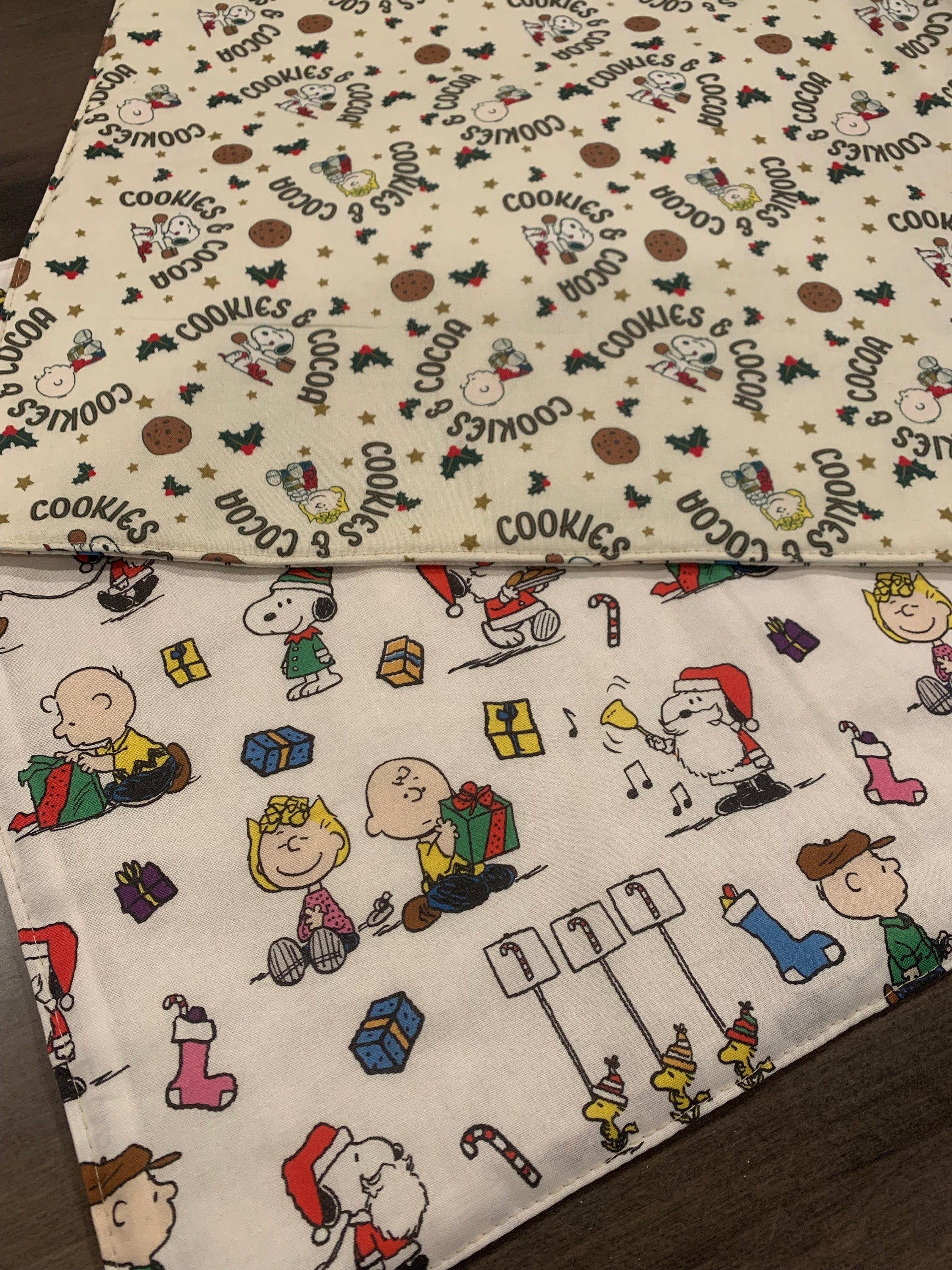 NEW Handmade REVERSIBLE quilted table runner. Snoopy Christmas decorations/ Christmas fabric, peanuts decorations New fabric.